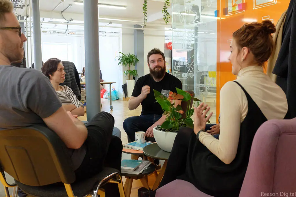 nathan and Emma chat in the office