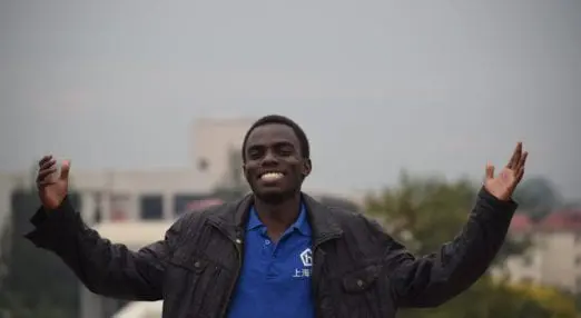 Man with arms apart looking happy