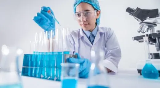 scientist with test tubes