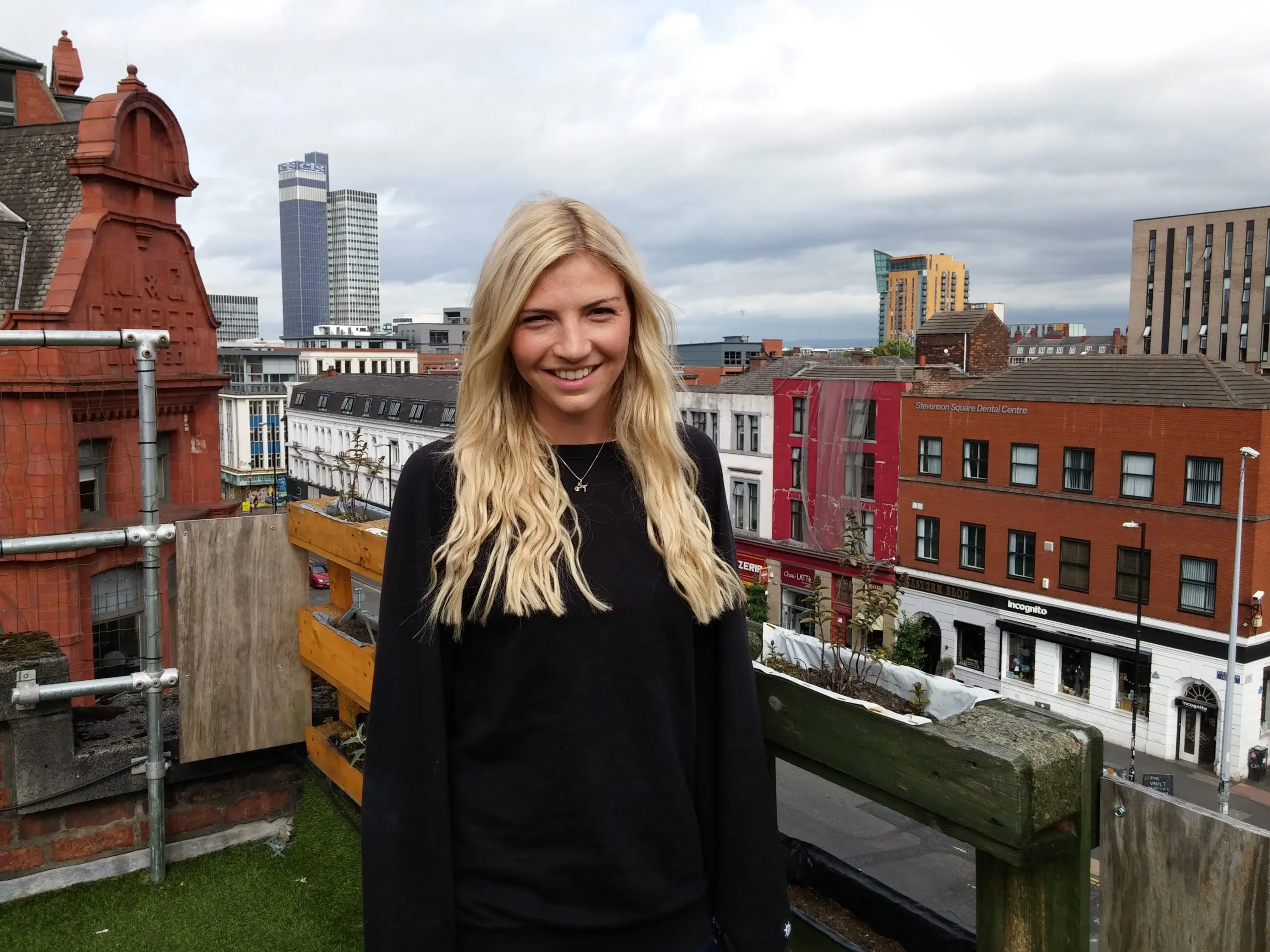 girl stood on a manchester rooftop
