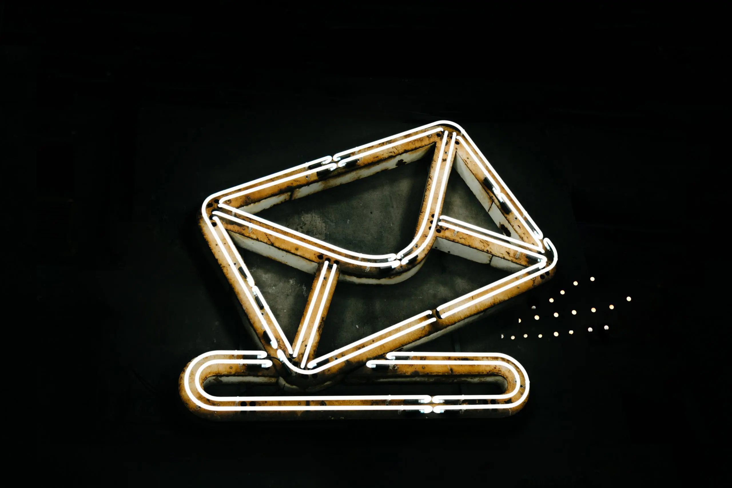 black background with a bright neon email icon