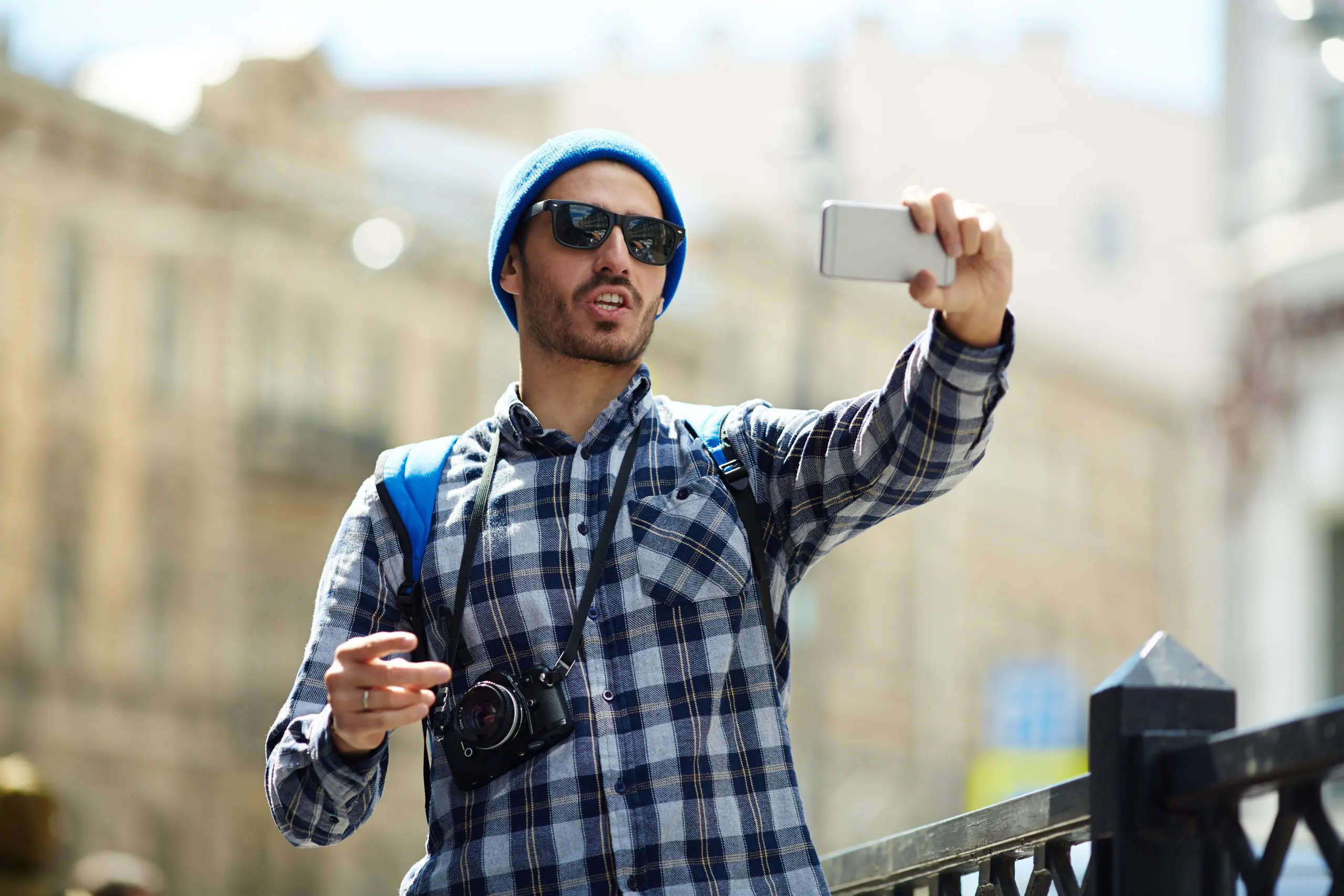 man taking selfie outside