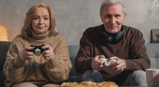 an older couple playing video games