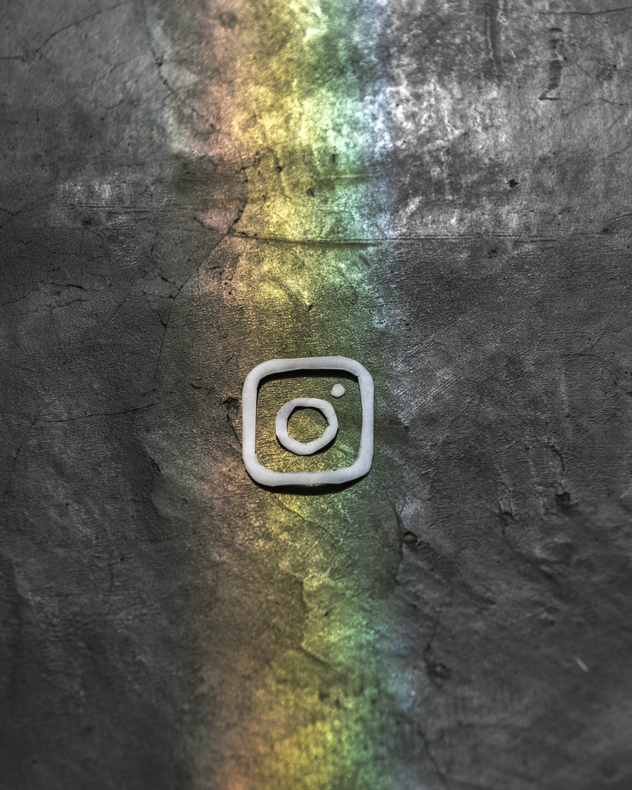 instagram logo with rainbow behind