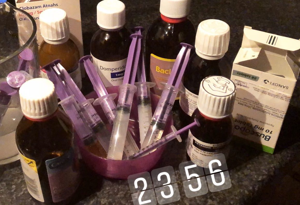 bottles of medicine annotated with the word tired and a timestamp of 23:55