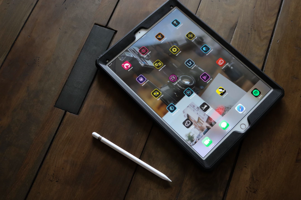 an iPad and a stylus on a table