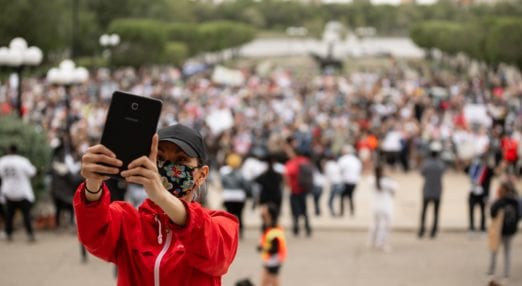 woman wearing a mask on mobile phone
