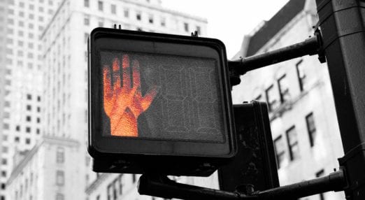 red hand on a pedestrian crossing sign