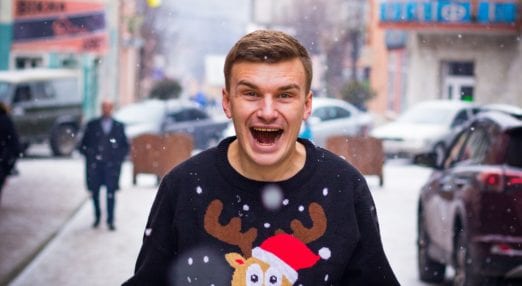 happy man in christmas jumper