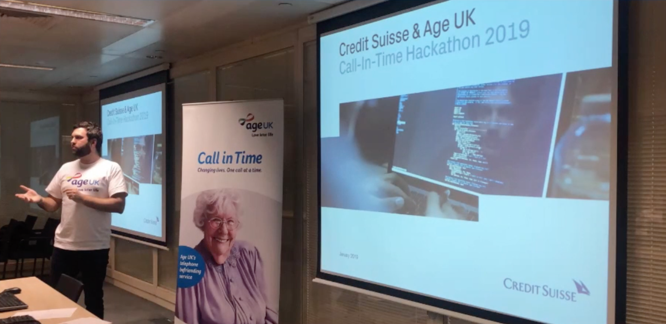 a man stands in front of a presentation that says Credit Suisse and Age UK Call In Time Hackathon 2019