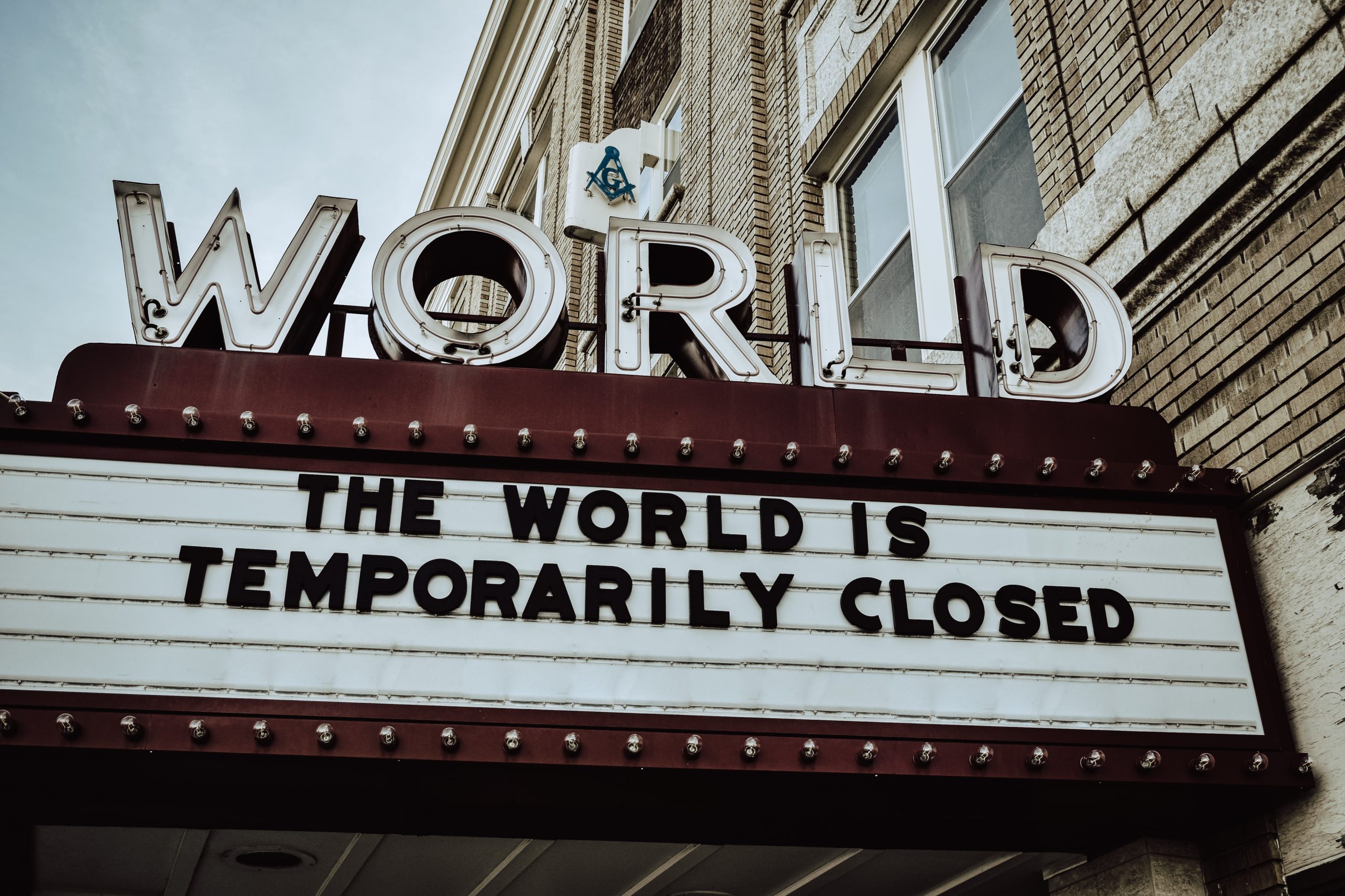 sign saying 'the world is temporarily closed'