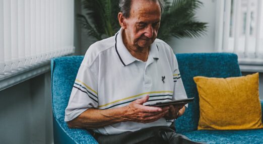 Blind veteran fred using a tablet